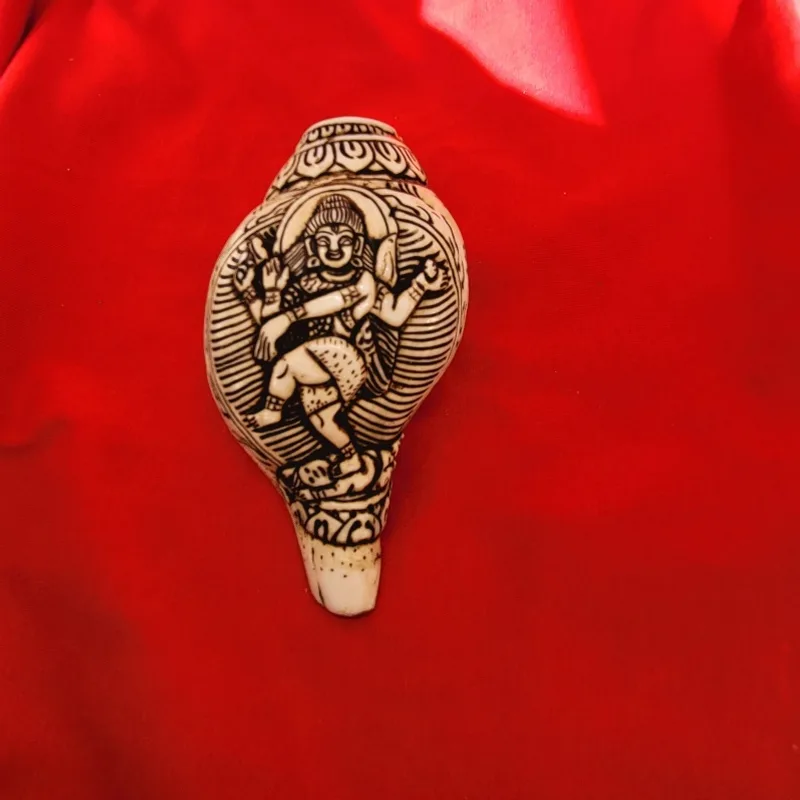 Conch shell hand-carved with a dancing Nataraja and inked detail