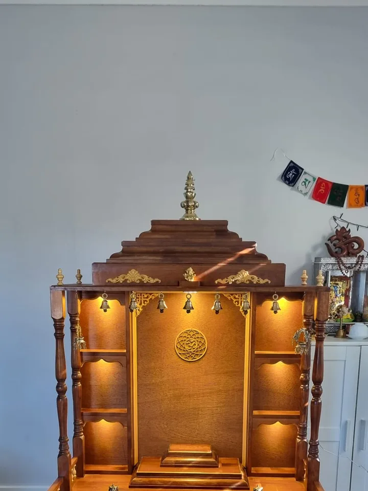 Warm Brown Japan mandir with a stepped temple crown, turned pillars and lit inner shelves